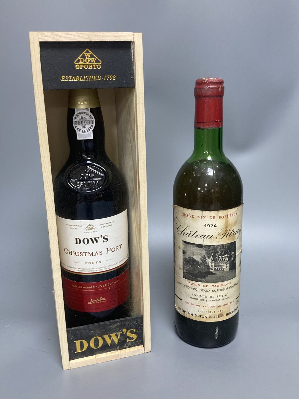 One bottle of Dows Christmas Port and a bottle of Chateau Pitray 1974